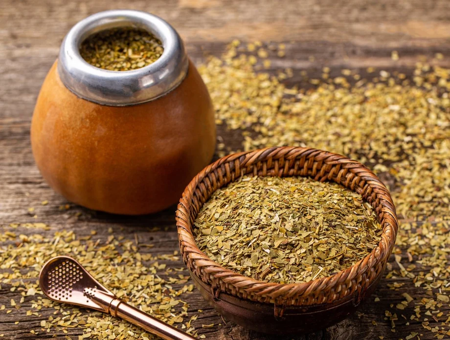 Yerba mate leaves and a traditional mate gourd